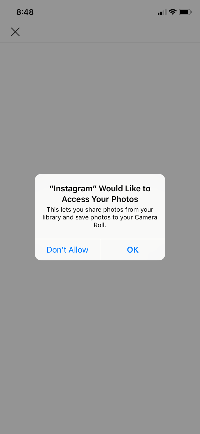 An image of an iOS permission request from Instagram that reads: "Instagram" would like to access your photos. This lets you share photos from your library and save photos to your camera roll.